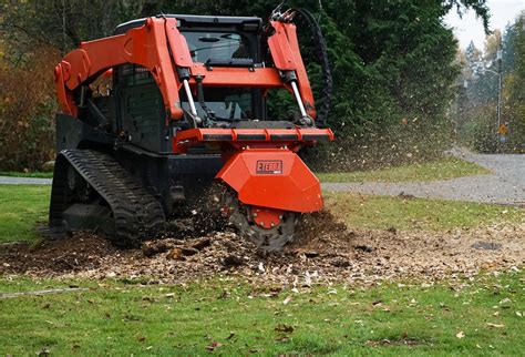 clearing trees with skid steer|stump grinder skid steer.